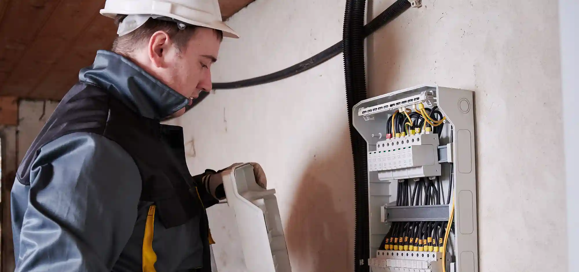 service_0000_male-electrician-checking-switchboard-basement